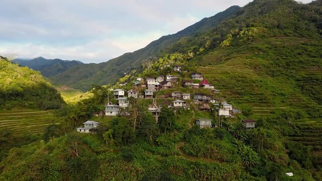 Traditional Houses In Village On Top Of Hill With Batad Rice Terraces In Banaue, Ifugao, Philippines. - aerial