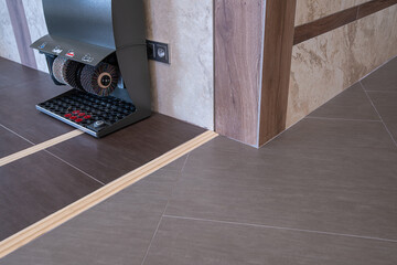 Electric machine for cleaning various types of shoes, LOCATED at the ENTRANCE to a LUXURY MODERN...