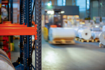 Metal shelves for storage on the background of a warehouse.