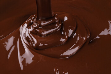 liquid dark chocolate flowing, sweet dessert background