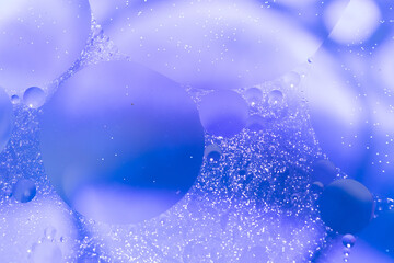 Oil with bubbles on colorful background.