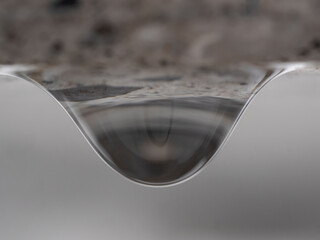 Water drop under the stone table 