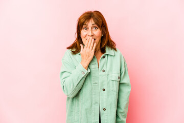 Senior caucasian woman isolated shocked, covering mouth with hands, anxious to discover something new.