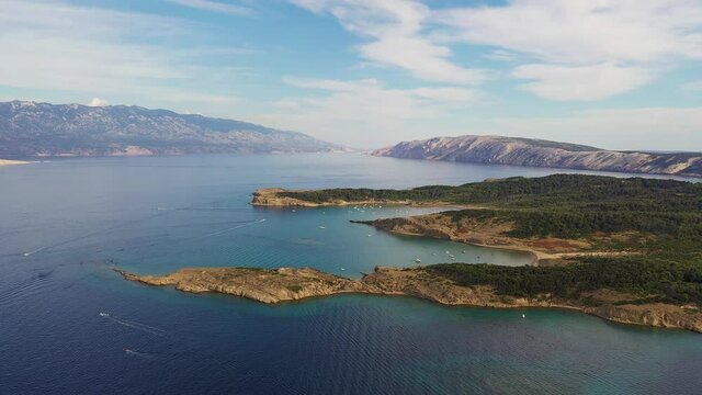 Aerial drone footage of the idyllic sandy beach of Ciganka of the Rab island in the Dalmatia region of Croatia in the Adriatic sea. 