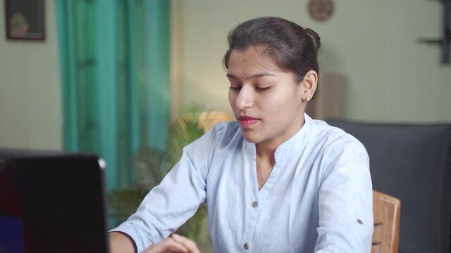 young business woman praying in front of laptop after completion of online test or examination for results - Concept of believe, gratitude in god