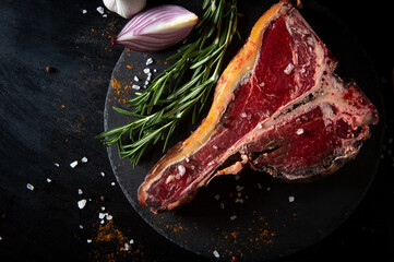 Raw aged beef steak. Porterhouse steak. Cooking beef steak. T-bone steak.