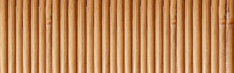 Panorama of Old brown bamboo fence pattern and seamless background