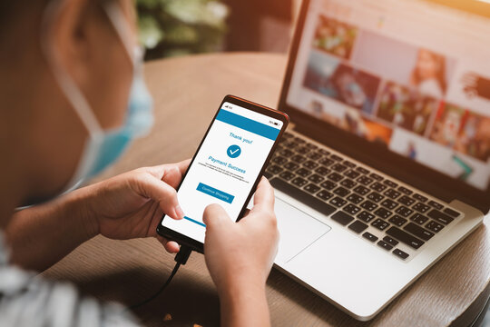 Woman making online payments on cell phone. Online shopping concept. Payment Success notify on smartphone
