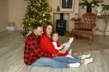 Family, winter holidays and people - a happy family. Little daughter and her parents. 