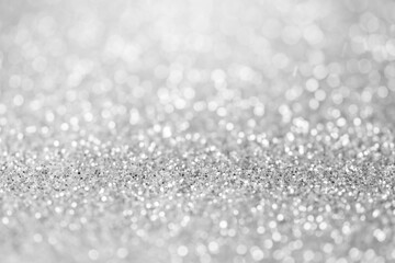 blurred sparkling silver color glitter light as abstract festive background for website banner and card decoration design