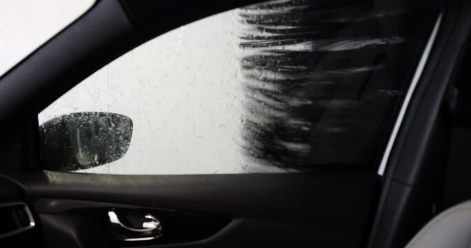 automatic car wash brushes working. inside view
