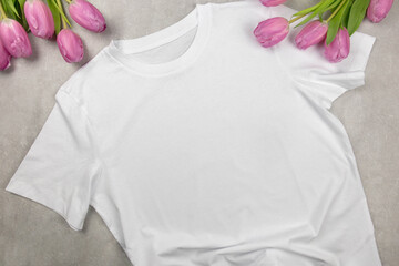 White womens cotton Tshirt mockup with pink tulips. Design t shirt template, print presentation...