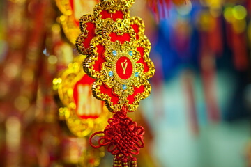 lucky knot lunar new year decoration in Vietnam with gold and red colours. Asian new year. Chinese lunar new year background.