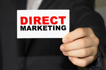 Card with text DIRECT MARKETING on hand. You can use in business, marketing and other concepts. Messege of the day.