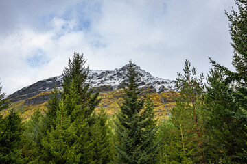 Valley of Kåfjorddalen with snow mountains
