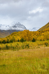 Obraz premium Valley of Kåfjorddalen with snow mountains