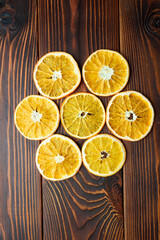 orange dehydrated slices on wooden surface