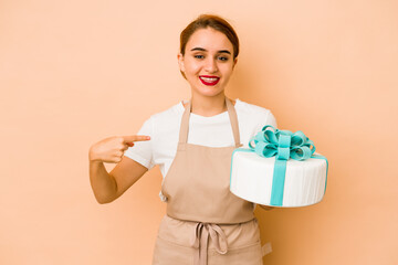 Young skinny arab pastry chef woman person pointing by hand to a shirt copy space, proud and confident