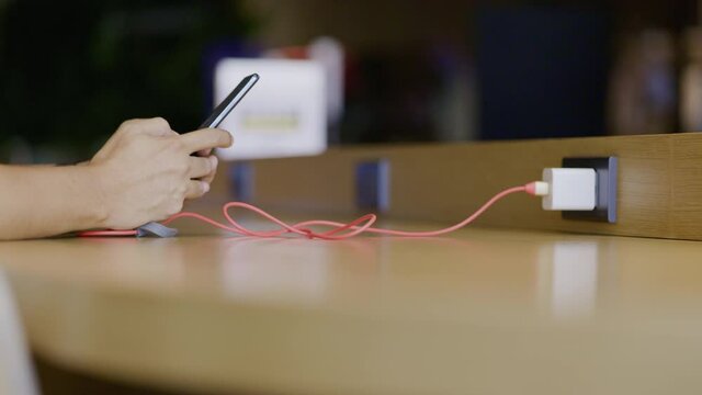 People are using charger for playing their phone Or smartphone in the service area. High speed internet technology in the building
