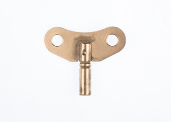 golden key for alarm clock isolated on white background