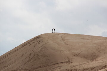 Fototapeta na wymiar couple on sand dune 