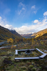Yellow valley with snow mountains on the side near Skibotn in Norway