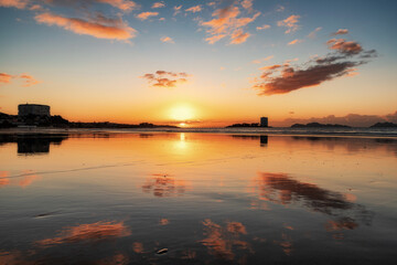 Naklejka premium Reflections of clouds on the beach