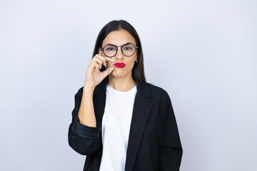 Beautiful business woman mouth and lips shut as zip with fingers. Secret and silent, taboo talking