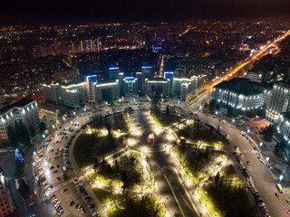 Aerial night view with holidays illumination lights of Derzhprom and Karazina National University...