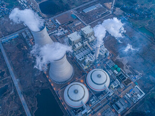Nuclear power plant after sunset. Dusk landscape with big chimneys.At dusk, the thermal power plants 