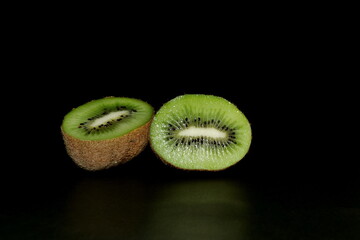 kiwi fruit isolated on a black background. Space for text