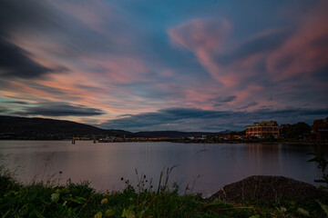 Shore of Tromsø during sunset with mountains in the background