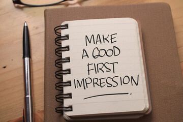 Make a good first impression, text words typography written on book against wooden background, life and business motivational inspirational