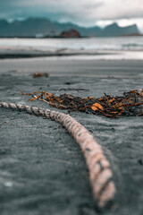 Rope in sand on a beach in Norway