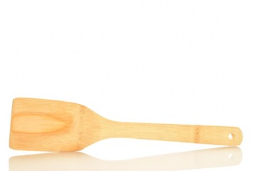 One wooden spatula, for the kitchen, close-up, isolated on white.