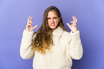 Young caucasian cute woman screaming with rage.