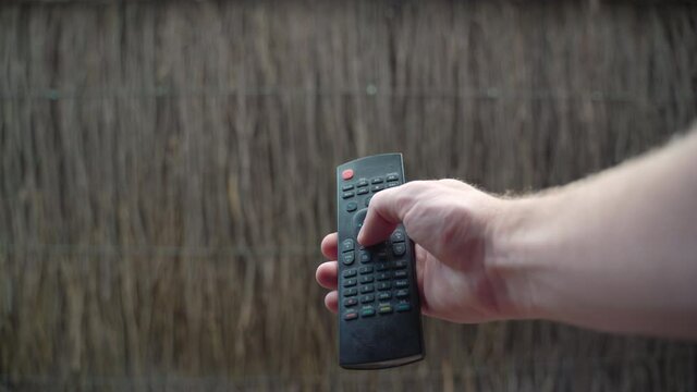 Classic POV shot of someone using a TV remote