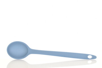 One silicone blue spoon, for the kitchen, close-up, isolated on white.