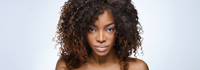  Beautiful black woman . Beauty portrait of african american woman with clean healthy skin on beige...