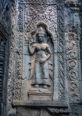 Та Prohm is the temple, it rains in the rainy season.The preserved symbiosis of stone and wood allows us to see Ta Prohm in this form.Bas-relief.(Cambodia, 04.10. 2019).