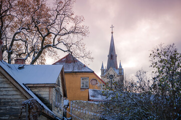 Fototapeta na wymiar View of the Church of St. John from the old streets of the small town of Cesis. Latvia