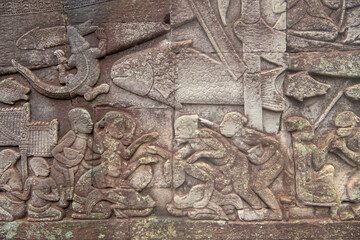  Bayon the central temple of Angkor Thom, late 12th century. Bas-relief. It rains in the rainy season. (Cambodia, 04.10. 2019)