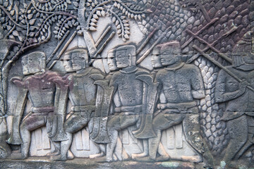   Bayon the central temple of Angkor Thom, late 12th century. Bas-relief. It rains in the rainy season. (Cambodia, 04.10. 2019)