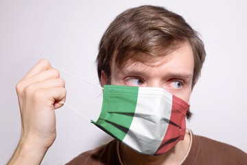 Young Italian man wearing Italy face mask during coronavirus pandemic