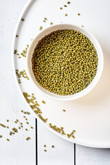 Raw mung beans in a bowl.
