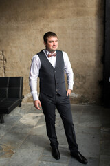 Man in business suit and bow tie