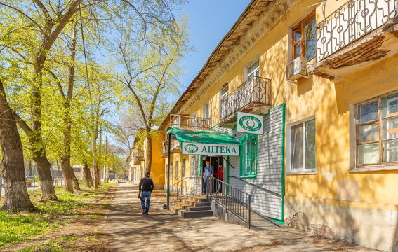 Russia, Samara, April 2016: entrance to the pharmacy, located on the first floor of an old residential building on a spring sunny day. The text in Russian: pharmacy aliya protection is yours.