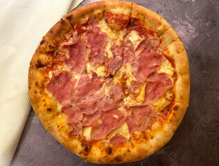 Ham and cheese pizza, also known as pizza cardinale with tomato sauce.