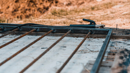 Welding a metal profile at home, a man welds metal to design an aviary for a dog.