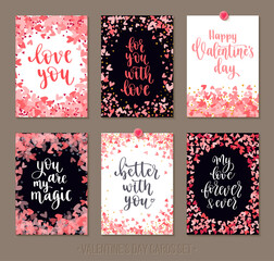 Set Valentine's Day greeting cards with lettering and decorative hand drawn love elements.